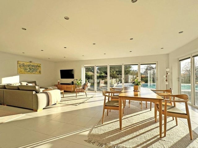This property comes with six bedrooms, five bathrooms and two reception rooms as well as a swimming pool and a spacious garden.