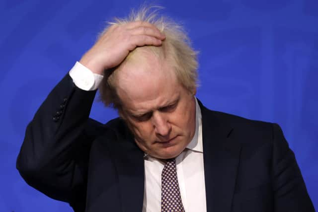 Britain's Prime Minister Boris Johnson gestures as he attends a media briefing on the latest Covid-19 update in the Downing Street briefing room, central London on November 27, 2021. Picture: HOLLIE ADAMS/POOL/AFP via Getty Images