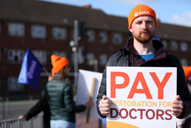 Dr Joshua Morton on the picket line outside QA Hospital on Thursday. Picture: Chris Moorhouse