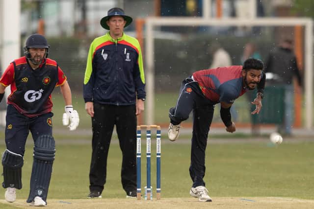 Havant bowler Richard Jerry as the rain falls against Hook & Newnham Basics.  Picture: Keith Woodland