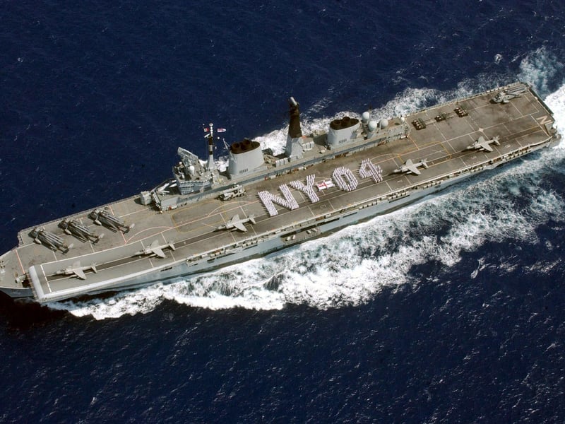 Nearly 500 members of the crew of the Royal Navy's HMS Invincible spell out the letters NY 04 ahead of a six day visit there. 23rd June 2004. Picture: LA(Phot) Dave Gallagher / HMS Invincible / Crown Copyright.