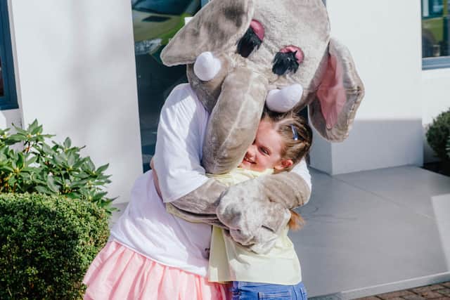 Everlynn Hunt, eight, with Emily the mascot for Friends of PICU