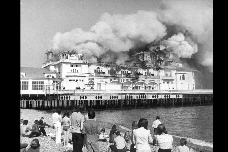 Locals gather to watch the pier burn down on June 11, 1974. The News PP4152