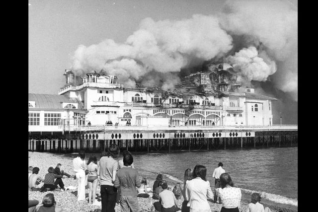 Locals gather to watch the pier burn down on June 11, 1974. The News PP4152