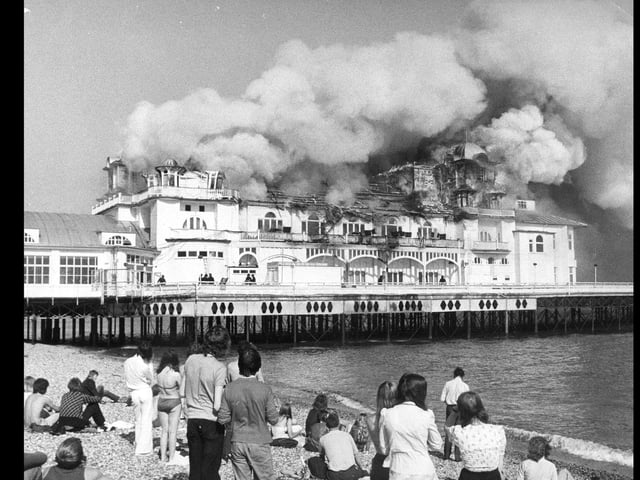 Locals gather to watch the pier burn down on June 11, 1974. The News PP4152