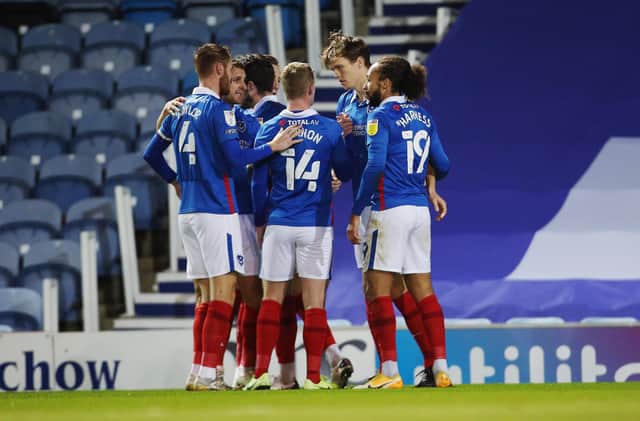 Pompey's players congratulate Sean Raggett on his first-half goal against Oxford this evening. Picture: Joe Pepler