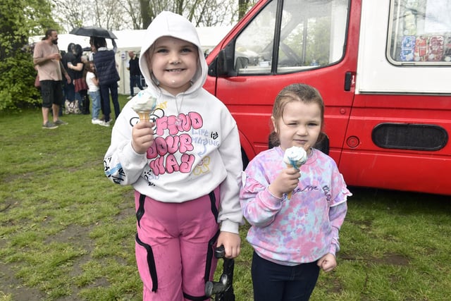 Sisters Penelope (9) and Ethel Simpson (4) from Portsmouth enjoyed their ice creams despite a brief, heavy shower.

Picture: Sarah Standing