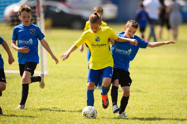 Action from the Clanfield youth football tournament at Horndean Technology College. Picture: Keith Woodland (270521-323)