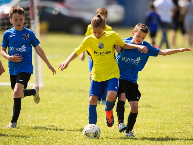 Action from the Clanfield youth football tournament at Horndean Technology College. Picture: Keith Woodland (270521-323)