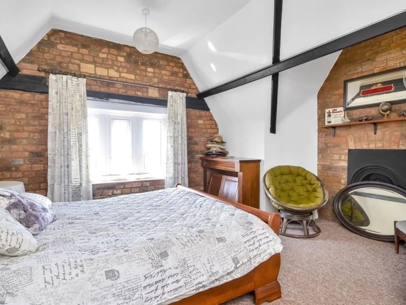 The listing says: "On entering the house through a set of twin arched doors, you are led into a foyer with a further arched door leading to hallway with staircase rising to the upper floors and doors to primary rooms including a 23’ sitting room with feature bay window, dining room, kitchen and conservatory on the ground floor."