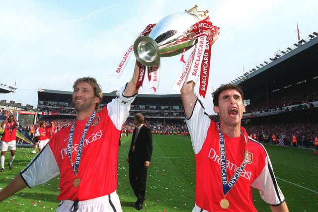 Tony Adams is regarded as an Arsenal legend. While playing for the Gunners, he won the First Division in 1988-89, 1990-91, 1997-98, and 2001-02. Pictured: Tony Adams and Martin Keown of Arsenal with the Premier League trophy after the match between Arsenal and Everton on May 11, 2002. Picture: Stuart MacFarlane/Arsenal FC via Getty Images.