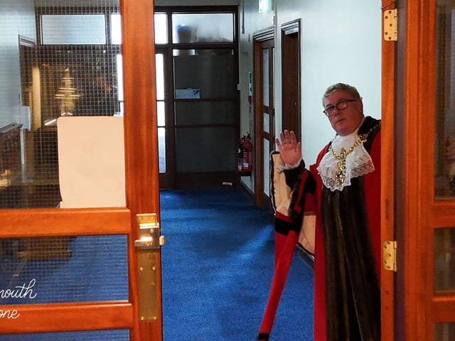The Lord Mayor opening the door for the drone