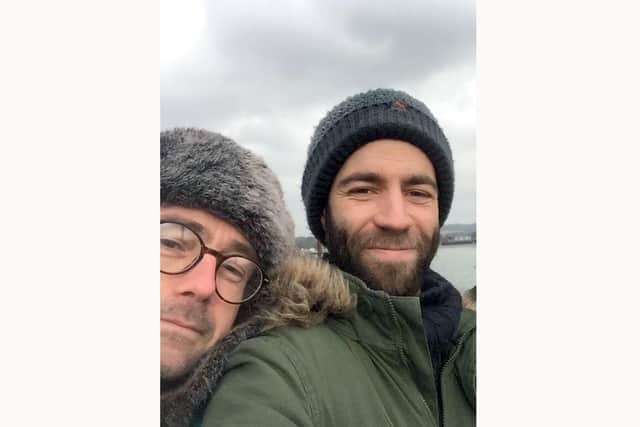 Daniel Radcliffe (left) and Ed Goodall who rescued the dog.