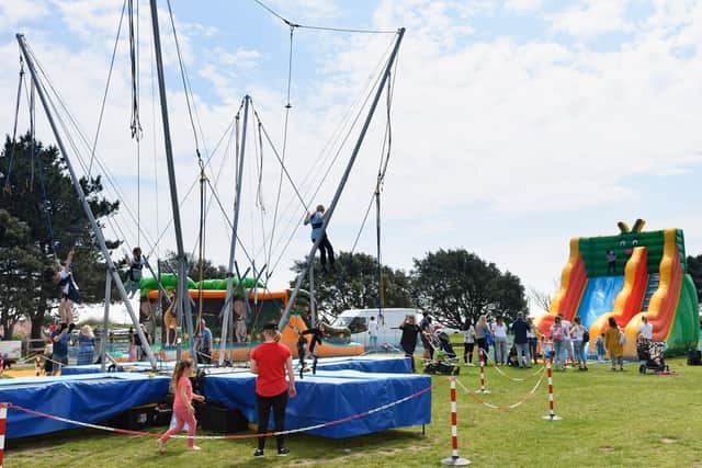 The sunny weather saw large crowds enjoy the rides near Canoe Lake. Picture: Keith Woodland