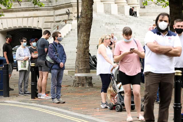 The queue at the Covid-19 Vaccination Centre at Lalys Pharmacy, Guildhall Walk, Portsmouth
Picture: Chris Moorhouse (jpns 100621-03)