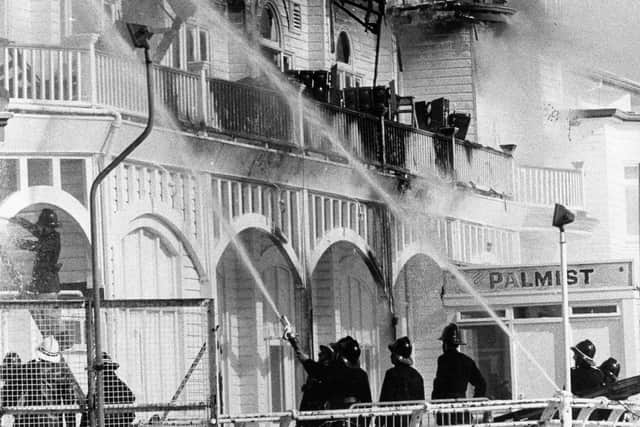 Southsea firefighters put out the flaming pier on June 11, 1974. Picture: The News PP4153