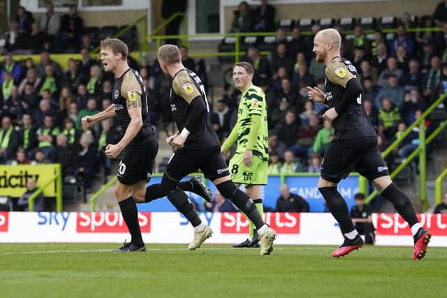 Sean Raggett celebrates his goal at Forest Green today