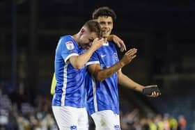 Pompey midfielder Alex Robertson with Pompey team-mate Gavin Whyte