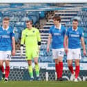 Hull's George Honeyman scores their second goal passed Portsmouthâ€™s Craig MacGillivray 