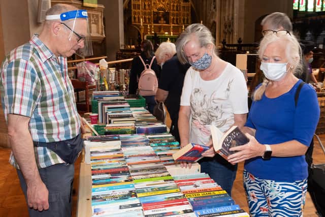 David Black looking after the bookstall as Deborah Lance and Denise Barlow browse
Picture: Keith Woodland (140821-11)