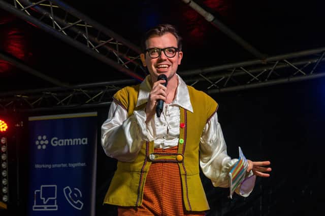 James Percy, in character as Silly Billy for Jack and the Beanstalk at the Kings Theatre, at the Christmas lights switch on in Commercial Road, November 2021. Picture: Mike Cooter (181121)