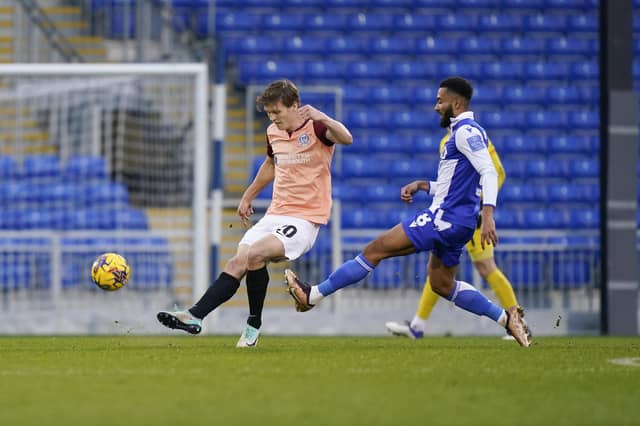 Pompey central defender Sean Raggett clears his lines against Bristol Rovers. Picture: Jason Brown/ProSportsImages