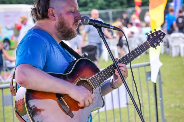 Pictured - Matthew Hovenden performing on the acoustic stage. Photos by Alex Shute.