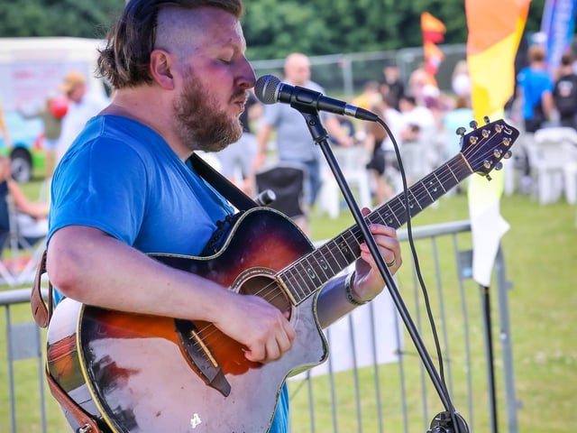 Pictured - Matthew Hovenden performing on the acoustic stage. Photos by Alex Shute.
