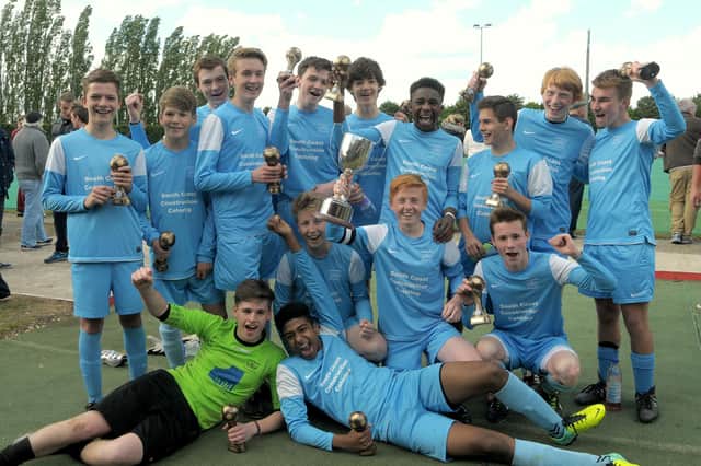 US Portsmouth under-16s celebrate winning the Portsmouth Youth League's Challenge Cup in May 2014. Frankie Paige, holding the trophy, is currently a regular in Glenn Turnbull's first team squad. Pic Mick Young.