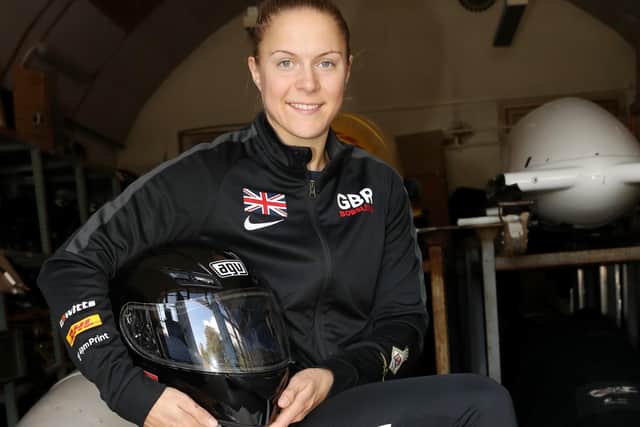 LPTI Haslam sat on her bobsleigh. Photo: Royal Navy