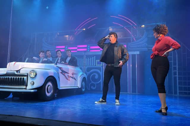 The T-Birds in Greased Lightnin', with Tom Wood as Kenickie and Amy Pickance as Rizzo