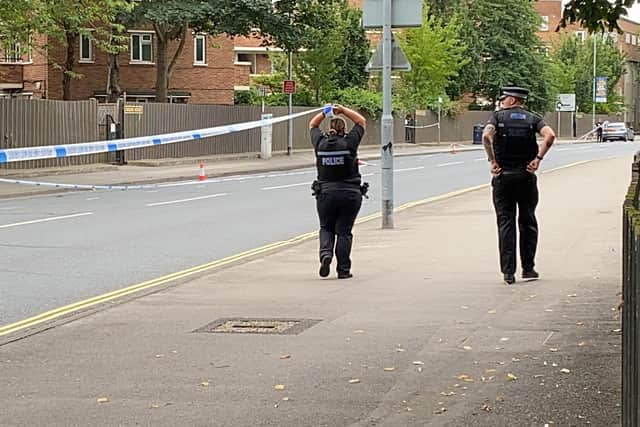 Officers pictured cordoning off Lake Road following the early-morning violence in the city centre. Photo: Tom Cotterill