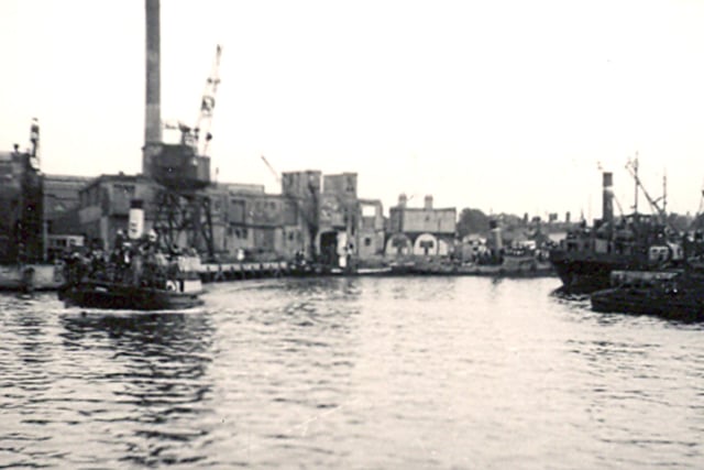 The Gosport ferry departing from the Camber, Old Portsmouth, circa 1950. Much bomb damage from the war still remains in the background.