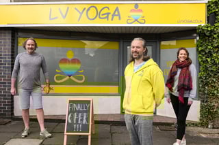 Luke Voulgarakis in yellow has reopened his yoga studio LV Yoga in West St, Fareham, after the Covid-19 restrictions were eased.  He is pictured with fellow yoga teachers Victoria Beale and Warren Bright.  Image: Chris Moorhouse (jpns 160521-07)