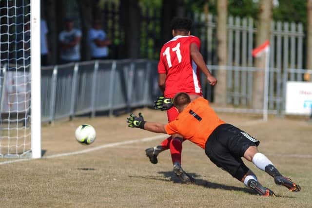 Rudi Blankson scores Horndean's late winner against Shaftesbury. Picture by Martyn White.