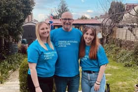 John with his daughters Amie (L) and Jess (R)