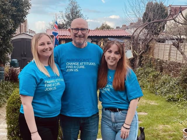 John with his daughters Amie (L) and Jess (R)