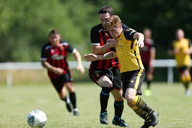 Callum Dart, right, in action for Baffins against Fleetlands in a pre-season friendly. Picture: Chris Moorhouse