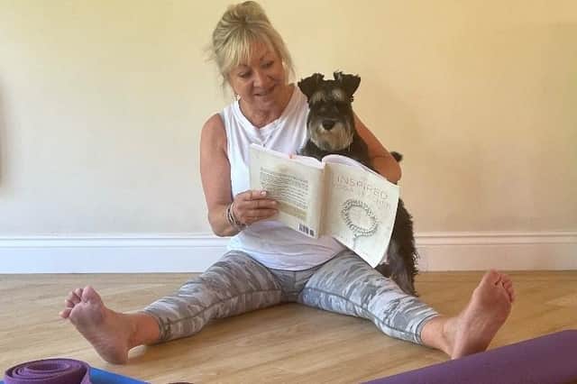 Karen and her dogo Hugo preparing for class