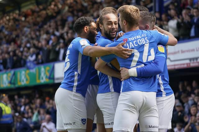 The Pompey players celebrate Ronan Curtis' fourth-minute opener against Gillingham