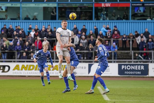 Colby Bishop rises highest to win the ball in the air against Carlisle. Picture: Jason Brown/ProSportsImages
