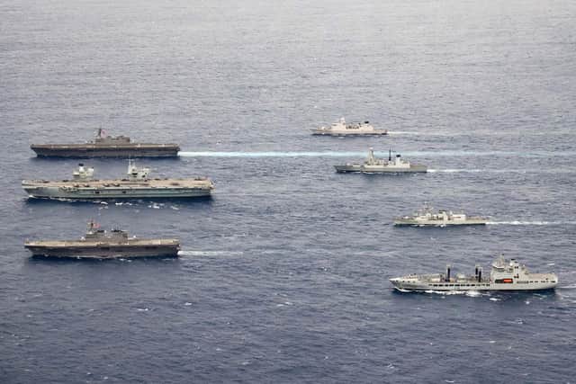 Pictured, left to right:  F-B JS Izumo, HMS Queen Elizabeth, JS Ise, HNLMS Evertsen, HMS Defender, HMCS Winnipeg and RFA Tidespring.