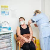 Wendy Peters preparing to give Jackie Blake a vaccination jab with shift leader, Megan Findlay at St James Hospital, Portsmouth on 17 February 2021

Picture: Habibur Rahman