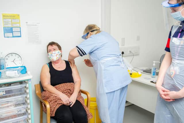 Wendy Peters preparing to give Jackie Blake a vaccination jab with shift leader, Megan Findlay at St James Hospital, Portsmouth on 17 February 2021

Picture: Habibur Rahman
