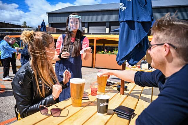 Members of the public enjoy a beer garden. Picture: Jeff J Mitchell/Getty Images