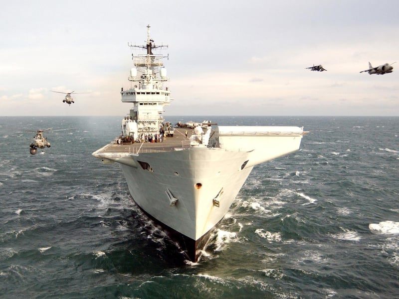 HMS Invincible. The formation included a Navl sea harrier FA2 from 801 Naval Air Squadron, GR7a Royal Airforce Harrier from 3(F) Squadron, two MK7 Seaking's one from 771 Naval Air Squadron and an 849B Flight seaking with HMS INVINCIBLE in the foreground.