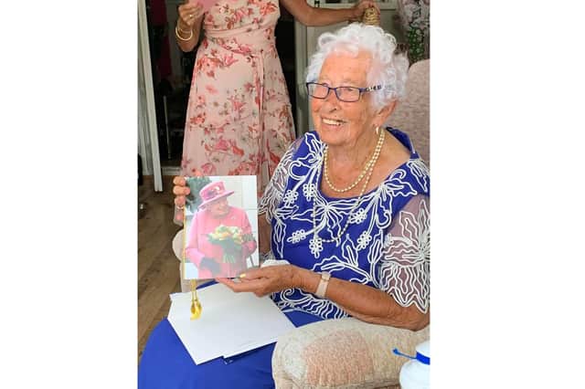 Eleanor with her card from the queen.