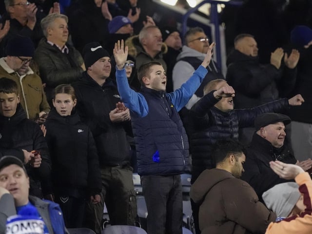 Pompey fans backed their team to a crucial Championship survival win over Cardiff last night.