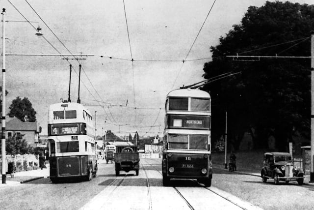 Portsmouth Road looking north circa 1935. Almost at the end of tramway days we see two trolleybuses passing in London Road. To the right would be Hilsea Barracks. Picture: Barry Cox collection.