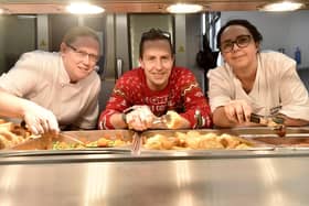 Beacon View Primary Academy in Paulsgrove held their annual community Christmas lunch on Friday, December 22.

Pictured is: (l-r) Cherri Hunt, Paul Reader and Katy Hickman, kitchen manager.

Picture: Sarah Standing (221223-4083)